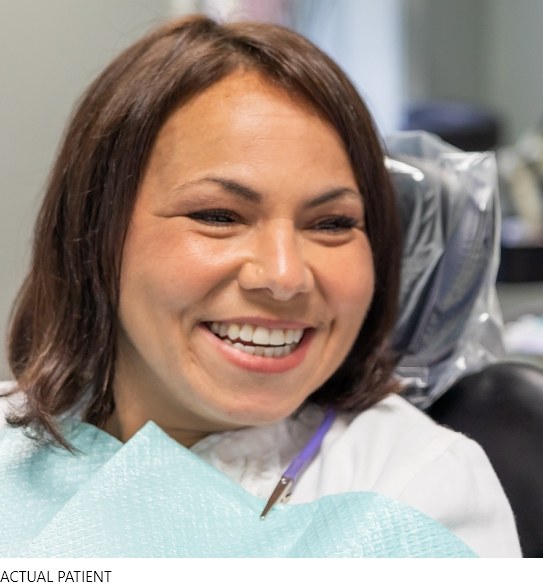 woman smiling in dentist chair